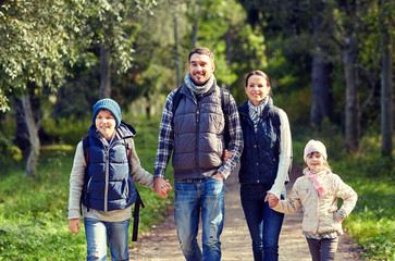 Fototapeta premium happy family with backpacks hiking