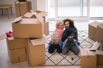 Young couple moving in a new flat