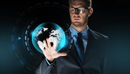 businessman with virtual earth globe projection