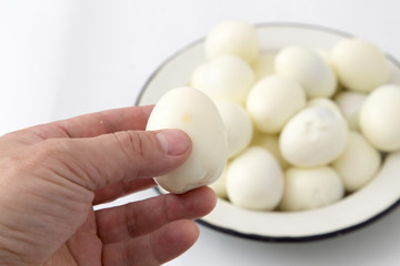 boiled eggs in a hand on a white background