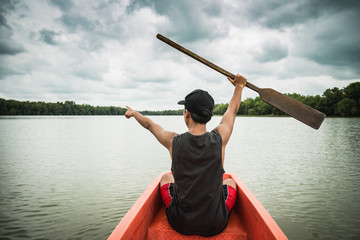 A man boating on lake