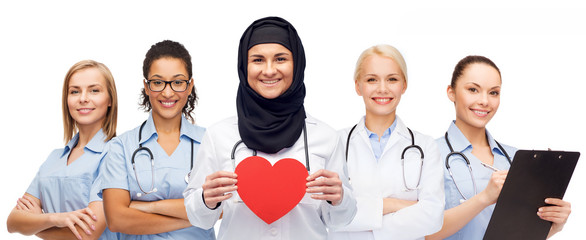 group of doctors with red heart and clipboard