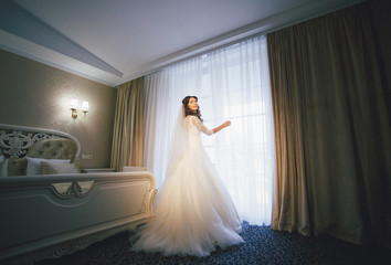 Luxury hotel room and young bride