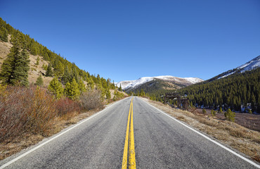 Scenic mountain road in autumn, travel concept picture, Colorado, USA.