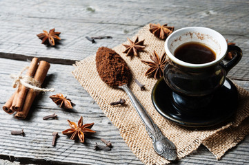Fototapeta na wymiar Fragrant spices, coffee, cinnamon, cloves and anise on sackcloth