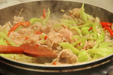 Cooking of fried spicy basil with minced pork topped lettuce.