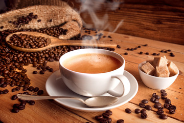 Cup of coffee with fresh coffee beans