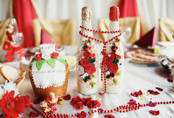 Two decorated bottles of champagne on the wedding celebration