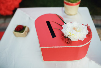 Red heart-shaped wedding gift box