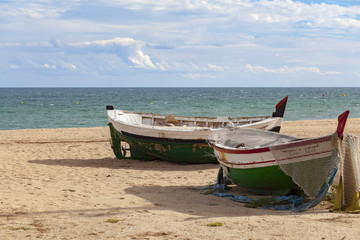 Obraz premium Old fishing boats in beach of Badalona, province Barcelona, Catalonia,Spain.