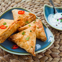 Indian Spicy Vegetable samosa with Mint Yoghurt Raita. © JoannaTkaczuk