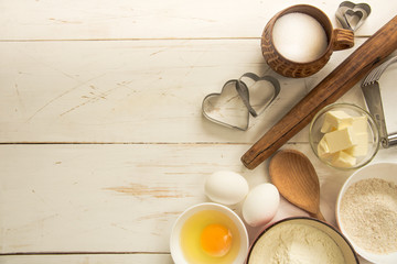 Baking ingredients for pastry on the wooden background