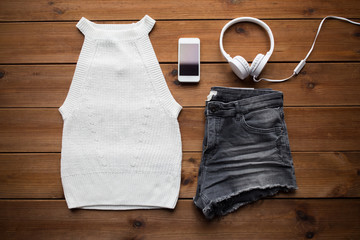 clothes and smartphone with headphones