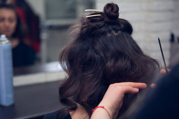 the hairdresser does a hair