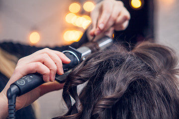 Fototapeta premium the hairdresser does a hair