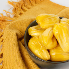 Tropical fruit Jackfruit (jakfruit, jack, jak) in bowl on white background. Selective focus © jantima