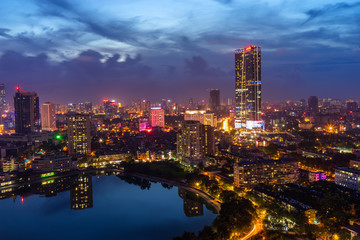Hanoi city by twilight period, with Giang Vo lake, Ba Dinh district. Aerial skyline view.