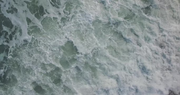 Drone flying over wavy sea
