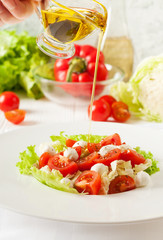 Vegetable salad with cherry tomatoes, mozzarella,  greens