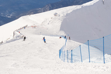 Fototapeta na wymiar People skiing descend.