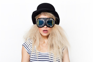 Pretty blonde girl portrait wearing strange sunglasses and black hat