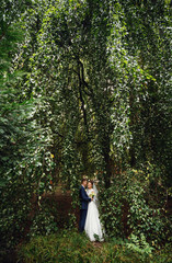 young couple embrace in a beautiful place