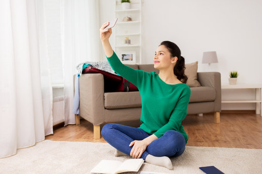 Woman With Smartphone Taking Selfie At Home