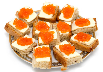 Red caviar sandwiches on white background