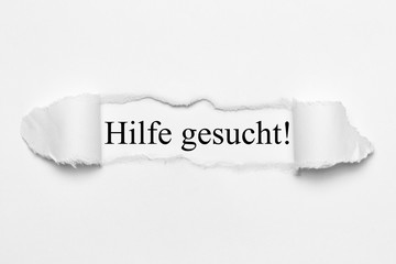 Fototapeta premium Hilfe gesucht! auf weißen gerissenen Papier