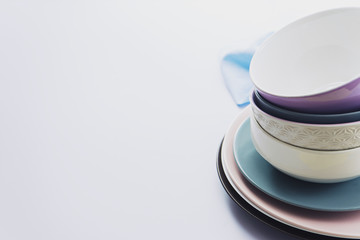 A lot of different plates and pialets on table