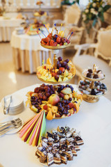 Buffet tables with cakse and  fruit