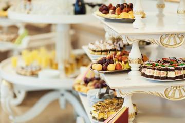 Buffet tables with cakse and  fruit