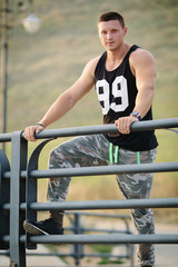 Portrait of young, happy and active sportsman outdoors