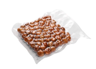 hazelnut packed in transparent plastic bag isolated on white background