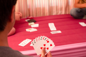 card on man hand in rummy game