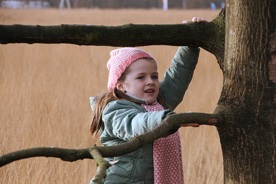 Girl climbing a tree