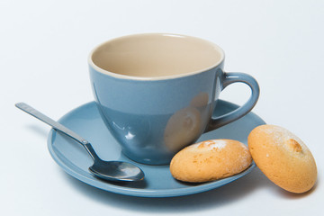 Empty tea cup with homemade cookies