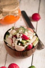 Salad with fresh vegetables and cottage cheese. White background