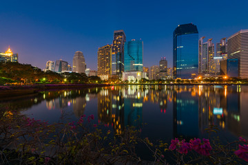 Fototapeta na wymiar Cityscape in the evening view from Benjakiti park in Bangkok, Thailand.