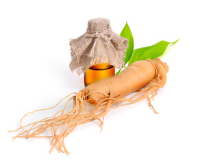 Ginseng root with pharmaceutical bottle and leawes.