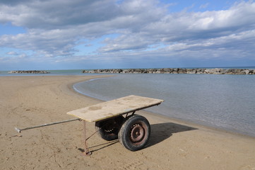 solitary handcart on the beach