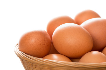 Close Up of Brown Eggs in Wicker Tray Copy Space