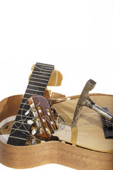 Rubbish guitar smashed to bits. White background with copy space