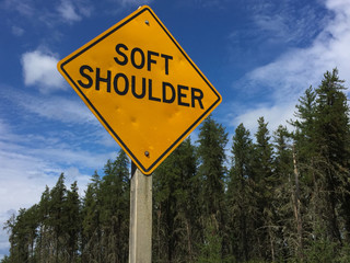 Soft Shoulder Sign Against Blue Sky