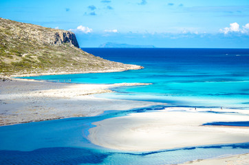 Amazing panorama of Balos Lagoon with magical turquoise waters, lagoons, tropical beaches of pure white sand and Gramvousa island on Crete, Greece