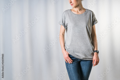 Download "Cropped image. Front view of young woman, dressed in ...