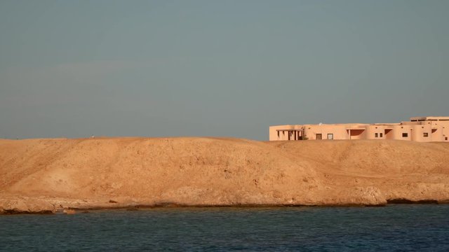 Architectural building on a deserted seashore.