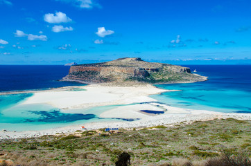 Amazing panorama of Balos Lagoon with magical turquoise waters, lagoons, tropical beaches of pure white sand and Gramvousa island on Crete, Greece