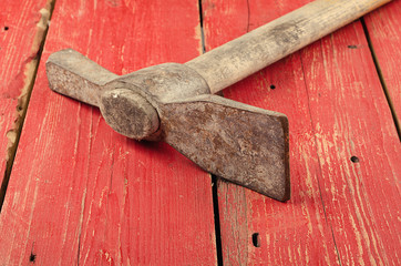 Tools. Pickaxe  on wooden background. Ready to work.