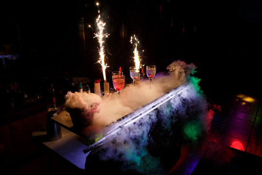 Table with cocktails and dry ice. Cocktail party
